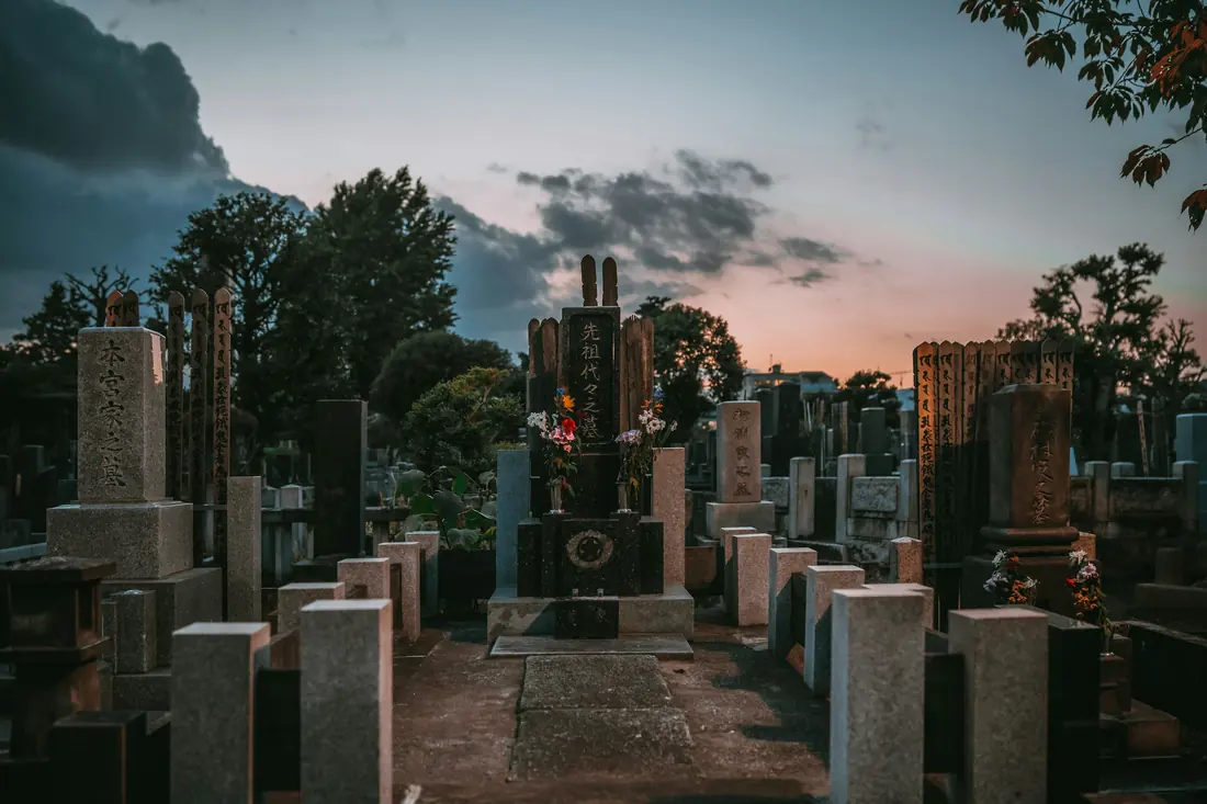 A quiet cemetery with headstones and mature trees