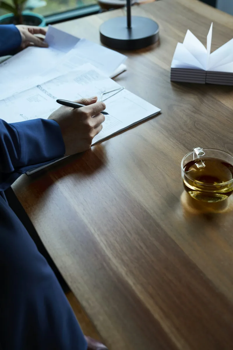 Paperwork and a laptop on a desk